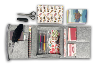 Light Gray Mobile Writing Desk open with paper, gel pens, stickers, feather pen and craft scissors