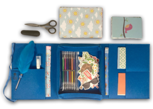 Ocean Blue Mobile Writing Desk open with paper, gel pens, stickers, feather pen and craft scissors