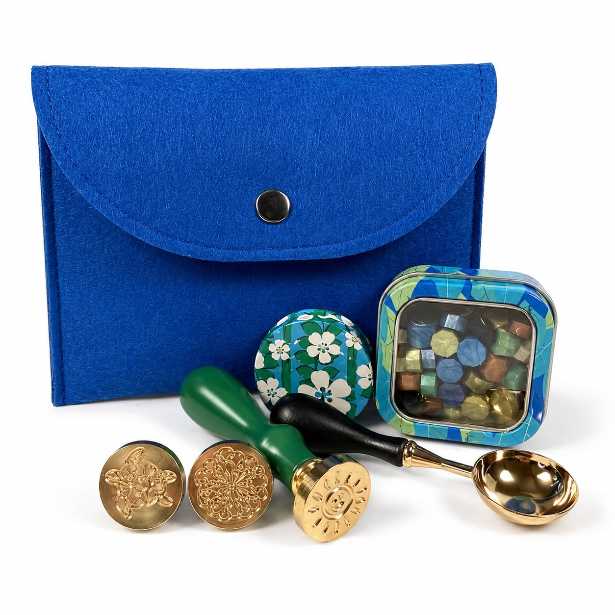 Holly Heide Ocean Blue Wax Seal Kit with blue felt pouch, three brass stamp designs, wax pearls, candle tin and gold pouring spoon.