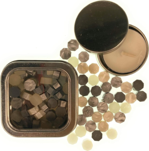 Silver Mix sealing wax pearls by Holly Heide in silver, gray, ivory and champagne tones with reusable metal storage tin and matching candle.